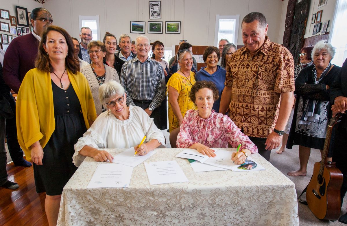 Whangārei Mayor Sheryl Mai, (seated left) and Northland Regional Council Chair Penny Smart sign the Manawhakahono ā Rohe agreements at Takahiwai Marae at the weekend. Standing beside them are Juliane Chetham, Patuharakeke Trust Board’s Environmental/Taiao Unit Manager, left, and the board’s Interim Chair Gilbert Paki.